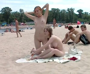 2 youngster college femmes nudists on the beach, Kiev,