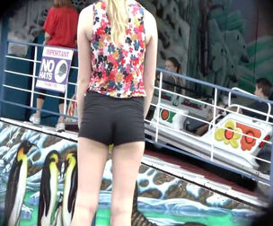 Nice 18yo woman with teensy bootie in brief shorts.