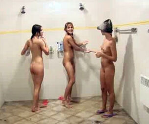 Nude nubile femmes lather each other in the bathroom after a